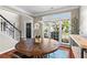 Dining area featuring hardwood floors and large windows at 920 Pebblestone Ct, Alpharetta, GA 30009