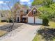 Beautiful brick home featuring a two-car garage and well-maintained landscaping at 920 Pebblestone Ct, Alpharetta, GA 30009