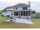 Large backyard features patio area perfect for outdoor entertaining at 1004 Spruce Creek Ln, Lawrenceville, GA 30045