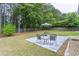 Spacious backyard with paver patio and outdoor seating area at 1004 Spruce Creek Ln, Lawrenceville, GA 30045