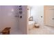 Modern bathroom with white subway tile, glass enclosed shower, and soaking tub with black fixtures at 1004 Spruce Creek Ln, Lawrenceville, GA 30045