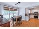 Dining area featuring natural light and sightlines into the kitchen at 1004 Spruce Creek Ln, Lawrenceville, GA 30045