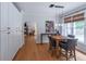 Open-concept dining area with natural light and an adjoining kitchen at 1004 Spruce Creek Ln, Lawrenceville, GA 30045