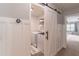 Convenient laundry room with modern sliding door, washer, and dryer at 1004 Spruce Creek Ln, Lawrenceville, GA 30045