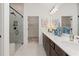 Elegant bathroom with a double vanity, frameless shower, and access to a spacious walk-in closet at 1307 Cedarcrest Blvd, Acworth, GA 30101