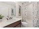 Bathroom featuring a vanity with a sink, toilet, and a bathtub/shower combination with a decorative shower curtain at 1307 Cedarcrest Blvd, Acworth, GA 30101
