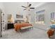 Bright Primary bedroom with large windows, a ceiling fan, neutral decor, and plenty of natural light at 1307 Cedarcrest Blvd, Acworth, GA 30101