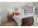 Cozy bedroom with a single bed, bedside table, two windows, and nature-themed art pieces at 1307 Cedarcrest Blvd, Acworth, GA 30101