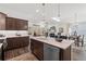 Modern kitchen featuring a marble island, stainless steel appliances, and a view of the open living space at 1307 Cedarcrest Blvd, Acworth, GA 30101