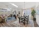 Open-concept living room with vaulted ceilings, a fireplace, and seamless access to the dining area at 1307 Cedarcrest Blvd, Acworth, GA 30101