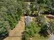 Aerial view of a home with a sprawling backyard, surrounded by trees at 250 Hembree Rd, Roswell, GA 30075
