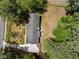 Aerial view of a home with an expansive driveway, manicured landscaping, and a private backyard at 250 Hembree Rd, Roswell, GA 30075