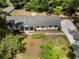 Aerial view of a home with manicured front yard, a private drive, and classic design at 250 Hembree Rd, Roswell, GA 30075