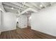 Finished basement featuring doorway, bright recessed lighting and hardwood floors at 250 Hembree Rd, Roswell, GA 30075
