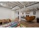 Finished basement showcasing a recreational area, neutral decor, and hardwood floors at 250 Hembree Rd, Roswell, GA 30075