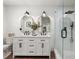 Modern bathroom featuring double vanity, walk-in shower, and sleek fixtures at 250 Hembree Rd, Roswell, GA 30075