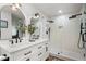 Modern bathroom featuring double vanity, walk-in shower, and sleek fixtures at 250 Hembree Rd, Roswell, GA 30075