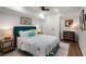 A colorful bedroom featuring vibrant accents, a comfortable bed, and a chic dresser with hardwood floors at 250 Hembree Rd, Roswell, GA 30075