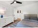 Bright bedroom with neutral decor, hardwood floors, and ample natural light at 250 Hembree Rd, Roswell, GA 30075