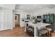 Modern kitchen with white cabinets, stainless steel appliances, and island with seating at 250 Hembree Rd, Roswell, GA 30075