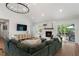 Bright living room with fireplace, stylish decor, and seamless indoor-outdoor flow at 250 Hembree Rd, Roswell, GA 30075