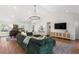 Open living concept with a kitchen, dining area, and exterior views, perfect for gatherings at 250 Hembree Rd, Roswell, GA 30075