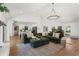 Spacious living room with vaulted ceiling and modern chandelier at 250 Hembree Rd, Roswell, GA 30075