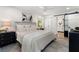 Bright main bedroom featuring a ceiling fan, ensuite bathroom, and elegant decor at 250 Hembree Rd, Roswell, GA 30075