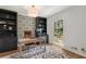 Bright home office featuring stylish wallpaper, built-in storage, and large window views at 250 Hembree Rd, Roswell, GA 30075