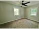 Bedroom featuring a ceiling fan and natural light from two windows at 3706 Larkspur Ter, Decatur, GA 30032