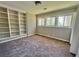 Bedroom with large windows, carpet floors and built in bookshelves at 3706 Larkspur Ter, Decatur, GA 30032