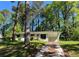 Charming exterior featuring light-colored brick and lush surrounding trees at 3706 Larkspur Ter, Decatur, GA 30032