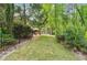 Expansive backyard featuring a lush lawn, mature trees, and privacy fence is perfect for outdoor activities at 5122 Cantrell Se Pt, Acworth, GA 30101