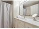 Bright bathroom featuring white cabinets, a marble countertop, and modern fixtures at 5122 Cantrell Se Pt, Acworth, GA 30101
