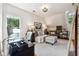 Bonus room with dark wood floors, desk, daybed, chair, and bright neutral paint at 5122 Cantrell Se Pt, Acworth, GA 30101