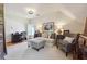 Bonus room with dark wood floors, daybed, desk, chair, and bright neutral paint at 5122 Cantrell Se Pt, Acworth, GA 30101
