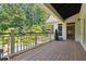 Lovely outdoor deck overlooking lush greenery and a serene pool at 5122 Cantrell Se Pt, Acworth, GA 30101