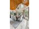 Elegant dining room featuring a wood-paneled vaulted ceiling, large windows, and a crystal chandelier at 5122 Cantrell Se Pt, Acworth, GA 30101