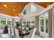 Elegant dining room filled with natural light, chandelier, and views of the lush outdoors at 5122 Cantrell Se Pt, Acworth, GA 30101