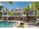 Picturesque rear exterior with a multi-level deck and a luxurious swimming pool at 5122 Cantrell Se Pt, Acworth, GA 30101
