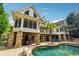 Charming rear exterior featuring a stone base, expansive deck, and an inviting pool area at 5122 Cantrell Se Pt, Acworth, GA 30101