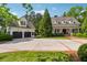 Estate featuring a main house and detached garage, with beautiful landscaping and a spacious driveway at 5122 Cantrell Se Pt, Acworth, GA 30101