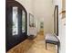 Grand foyer with a large arched door, travertine floors, and elegant decor, making a welcoming first impression at 5122 Cantrell Se Pt, Acworth, GA 30101
