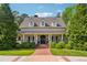 Charming home featuring a welcoming front porch,dormers, and well-manicured landscaping, creating great curb appeal at 5122 Cantrell Se Pt, Acworth, GA 30101