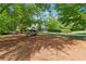 A lovely home sits behind a large lush front yard with mature trees offering lots of shade at 5122 Cantrell Se Pt, Acworth, GA 30101