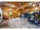 Well-maintained garage space featuring brick floors, wood paneling, and organized storage solutions at 5122 Cantrell Se Pt, Acworth, GA 30101