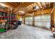 Spacious garage features brick flooring, wood paneled walls, and ample storage, perfect for a workshop at 5122 Cantrell Se Pt, Acworth, GA 30101