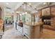 Spacious kitchen features a center island, brick fireplace, and access to the dining area at 5122 Cantrell Se Pt, Acworth, GA 30101
