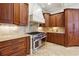 Chef's kitchen with custom wood cabinets, stainless steel appliances, and granite countertops at 5122 Cantrell Se Pt, Acworth, GA 30101