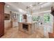 Bright kitchen with a center island, tiled floors, and views to the living and dining areas at 5122 Cantrell Se Pt, Acworth, GA 30101